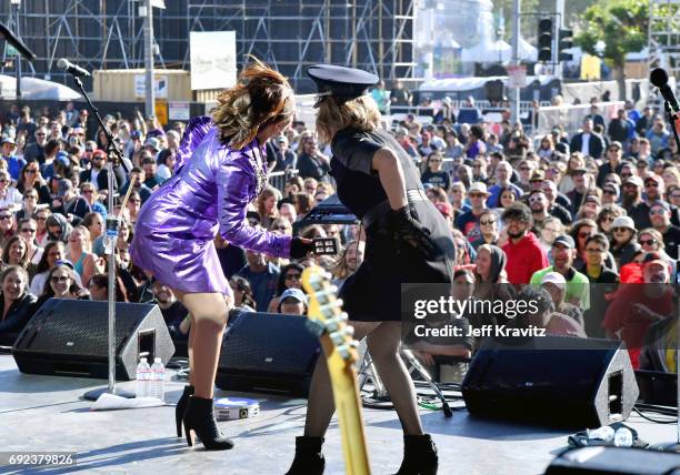 Maya Rudolph, right, and Gretchen Lieberum perform onstage at the Piazza Del Cluster Stage during Colossal Clusterfest at Civic Center Plaza and The...