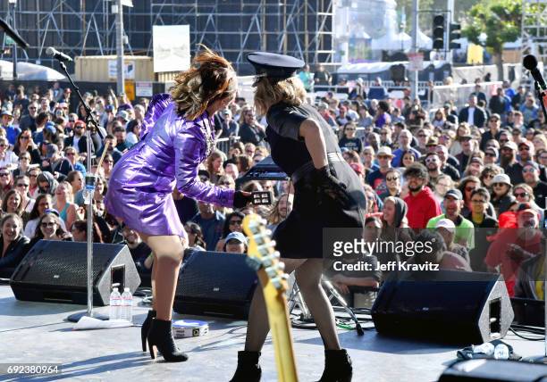 Maya Rudolph, left, and Gretchen Lieberum perform onstage at the Piazza Del Cluster Stage during Colossal Clusterfest at Civic Center Plaza and The...