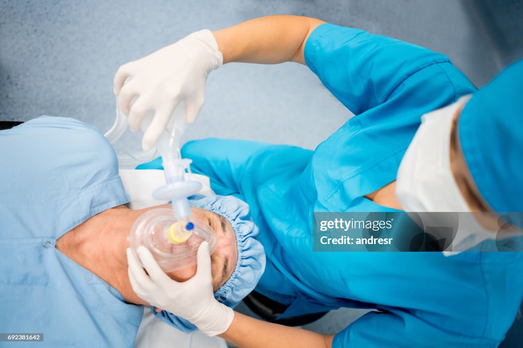 Nurse getting patient ready for surgery