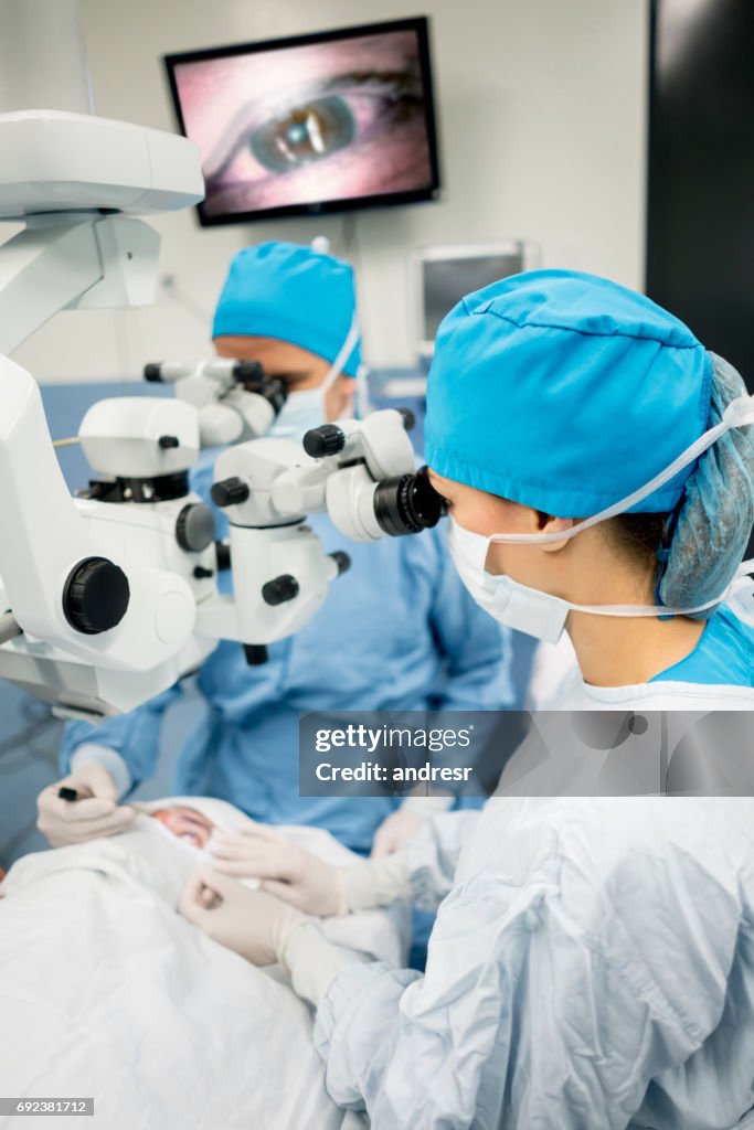 Ophthalmic surgeons performing an eye surgery at the hospital