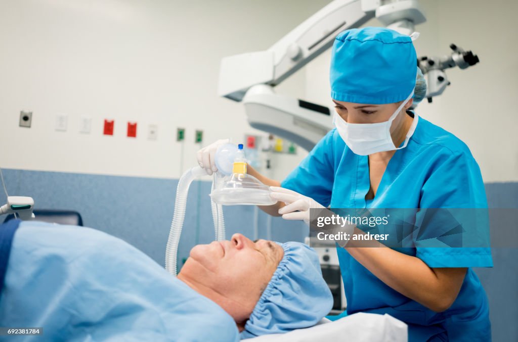 Nurse getting patient ready for surgery