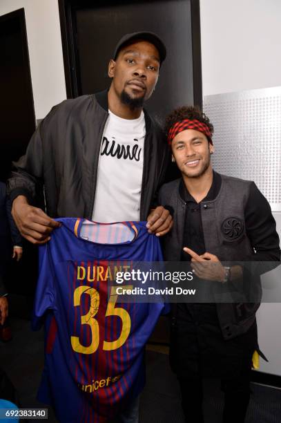 Kevin Durant of the Golden State Warriors and Neymar Jr. Of FC Barcelona poses for a photo after Game Two of the 2017 NBA Finals on June 4, 2017 at...