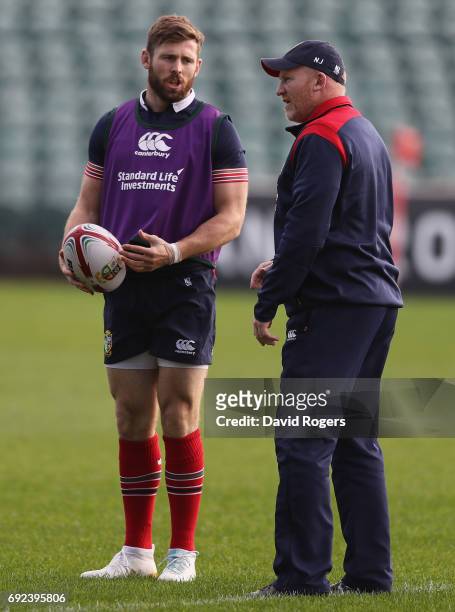 Elliot Daly talks to Lions kicking coach Neil Jenkins during the British & Irish Lions training session held at the QBE Stadium on June 5, 2017 in...
