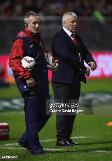 Rob Howley, the Lions backs coach looks on with head coach Warren Gatland during the match between the New Zealand Provincial Barbarians and the...