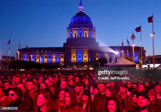 Festivalgoers attend a performance at the Piazza Del Cluster Stage during Colossal Clusterfest at Civic Center Plaza and The Bill Graham Civic...