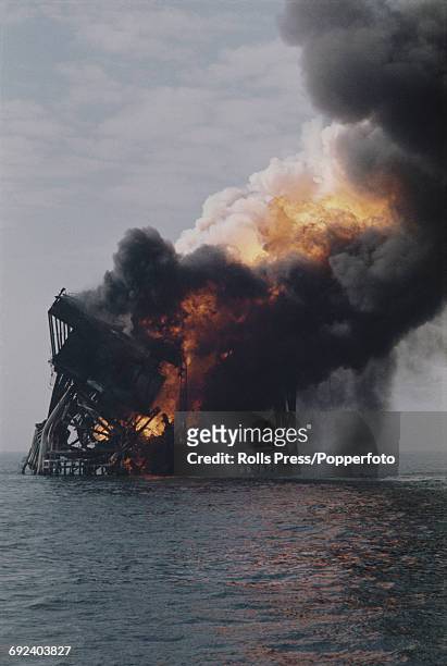 View of fire engulfing and destroying the Shell Platform B oil rig in the Bay Marchand field, 60 miles from the American city of New Orleans in the...