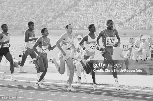 View of athletes competing in heat 3 of the quarterfinals of the Men's 800 metres event, with from left, Owen Hamilton of Jamaica , Bruce Roberts of...