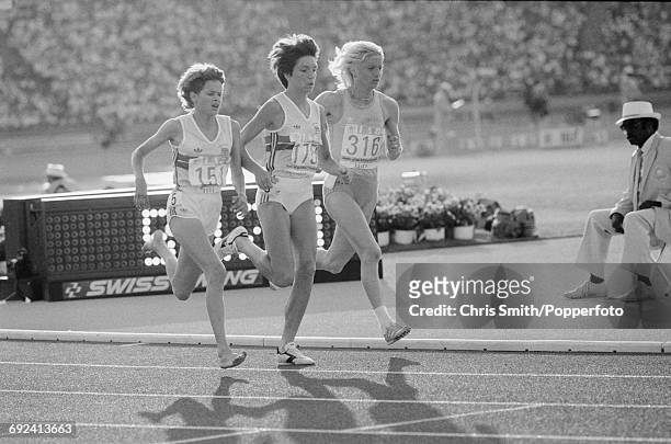 View of athletes competing in the final of the Women's 3000 metres event, with from left, Zola Budd of Great Britain running barefoot, silver medal...