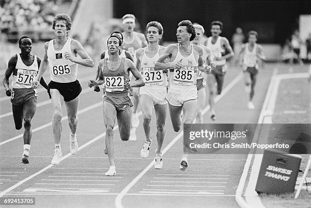 View of athletes competing in the final of the Men's 5000 metres event, with from left, Charles Cheruiyot of Kenya , John Walker of New Zealand ,...