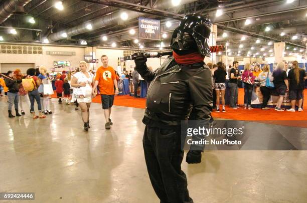 Cosplayer merges Darth Vader with Waling Dead's Negan charter on the opening day of Wizard World Comic Con. In Philadelphia, PA on June 1, 2017