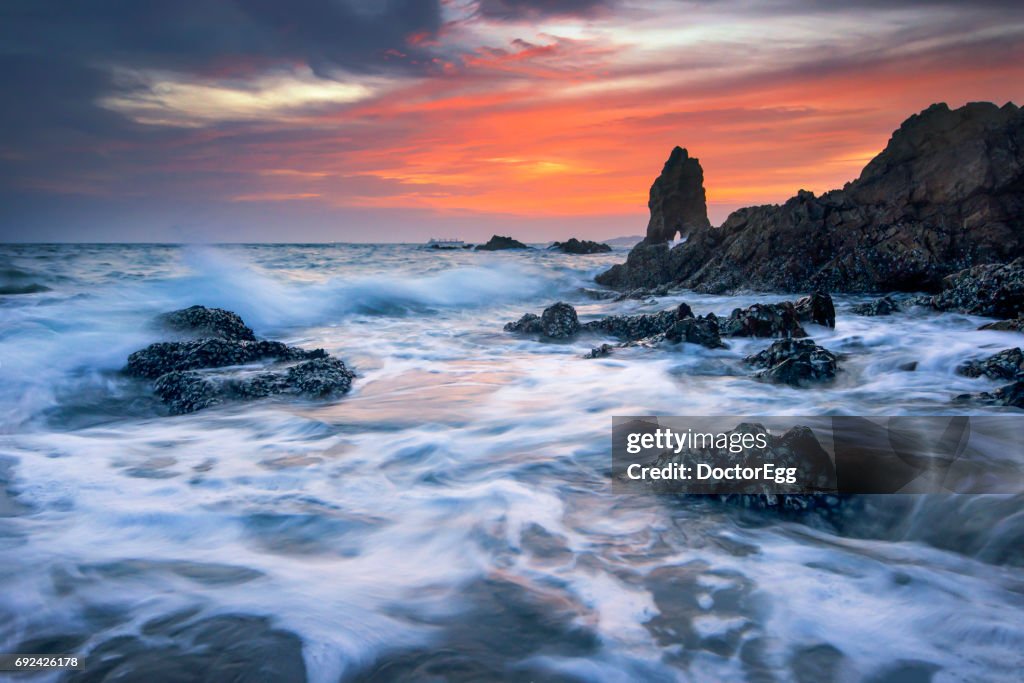 Seascape Tidal Wave and Beach Rock at Twilight