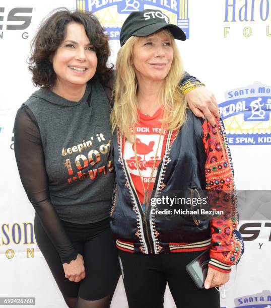 Joyce Hyser Robinson and Rosanna Arquette attend Pedal On The Pier at Santa Monica Pier on June 4, 2017 in Santa Monica, California.