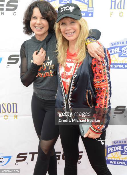 Joyce Hyser Robinson and Rosanna Arquette attend Pedal On The Pier at Santa Monica Pier on June 4, 2017 in Santa Monica, California.