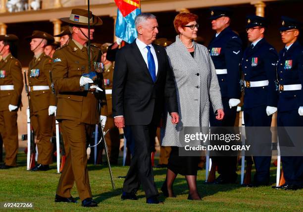 Secretary of Defence Jim Mattis walks with Australia's Defence Minister Marise Payne during an inspection of a guard of honour as part of the 2017...