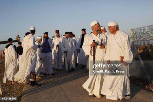 Samaritans participate in a traditional ceremony celebrating the giving of the Torah on "Shavuot festival", at Mount Gerizim near the West Bank city...