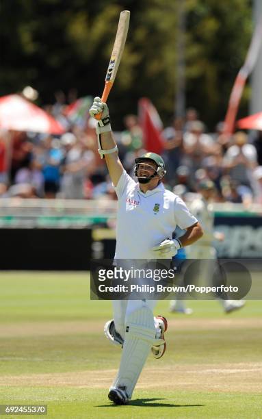 South Africa's captain Graeme Smith celebrates reaching his century on the third day of the 1st Test match at Newlands in Cape Town on the 11th of...