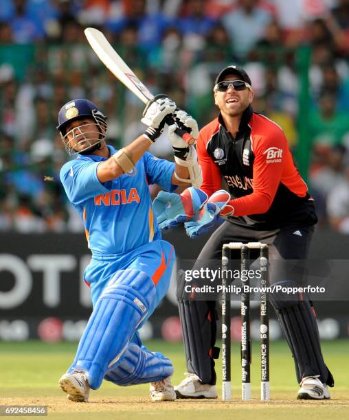 India's Sachin Tendulkar hits a six off England's Graeme Swann watched by Matt Prior during their ICC Cricket World Cup group B match against England...