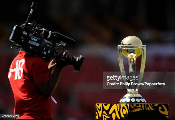 The trophy with a TV cameraman at the ICC Cricket World Cup group B match between Ireland and England in Bangalore on March 2, 2011.