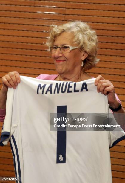 Manuela Carmena celebrates during the Real Madrid celebration the day after winning the 12th UEFA Champions League Final at Madrid town hall on June...