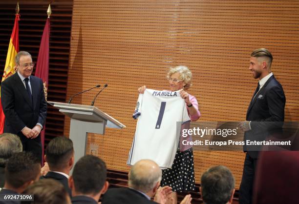 Florentino Perez, Manuela Carmena and Sergio Ramos celebrate during the Real Madrid celebration the day after winning the 12th UEFA Champions League...
