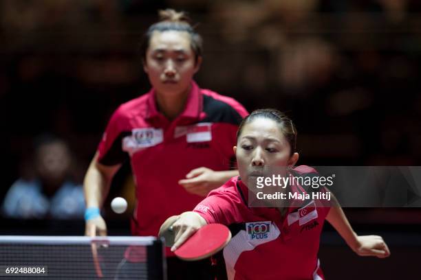 Tianwei Feng of Singapore and Mengyu Yu of Singapore in action during Women's Doubles Semifinals at Table Tennis World Championship at Messe...