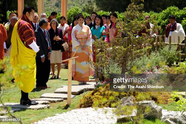 Princess Mako of Akishino , King Jigme Khesar Namgyel Wangchuck and Queen Jetsun Pema watch a Japanese garden during their visit a flower exhibition...