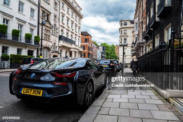 electric car, the bmw i8, is parked on an exclusive residential street in mayfair, london, uk - mayfair london stock pictures, royalty-free photos & images