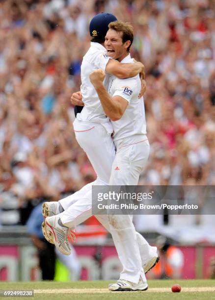 England's Chris Tremlett celebrates with Alastair Cook after the final wicket of Australia's Michael Beer in the 5th Test match at the Sydney Cricket...