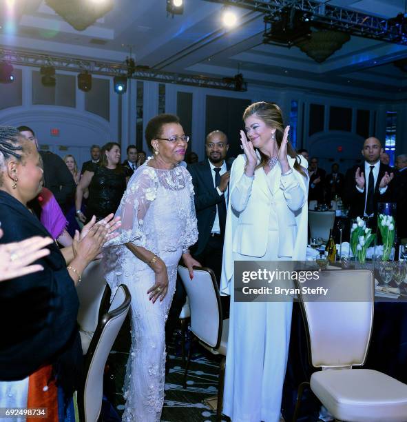 Model Kathy Ireland congratulates humanitarian Graca Machel as she recieves the "Diamonds Do Good" International Vanguard Award during the Diamond...