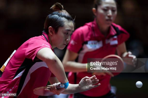 Tianwei Feng of Singapore and Mengyu Yu of Singapore in action during Women's Doubles Semifinals at Table Tennis World Championship at Messe...
