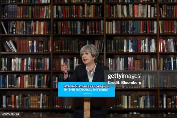 Theresa May, U.K. Prime minister and leader of the Conservative Party, gestures while delivering a speech at the Royal United Services Institute in...