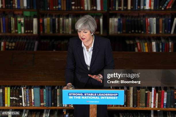 Theresa May, U.K. Prime minister and leader of the Conservative Party, gestures while delivering a speech at the Royal United Services Institute in...