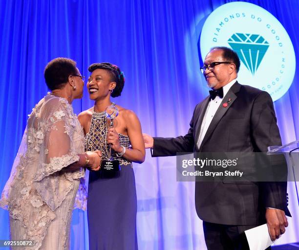 Humanitarian Graca Machel receives the "Diamonds Do Good" Global Humanitarian Award from Diamond Empowerment scholarship recipient Umazi Mvurya and...