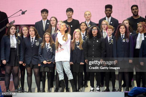 Free for editorial use. In this handout provided by 'One Love Manchester' benefit concert Ariana Grande performs on stage with Parrs Wood High School...