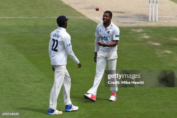 Sussex pace bowlers Jofra Archer and Chris Jordan have a chat during the fourth day of the Specsavers County Championship Division Two match between...