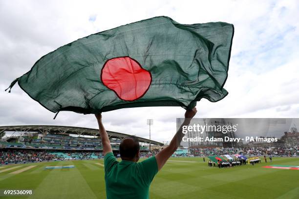 Bangladesh fan waves a flag in support of their team during the ICC Champions Trophy, Group A match at The Oval, London.