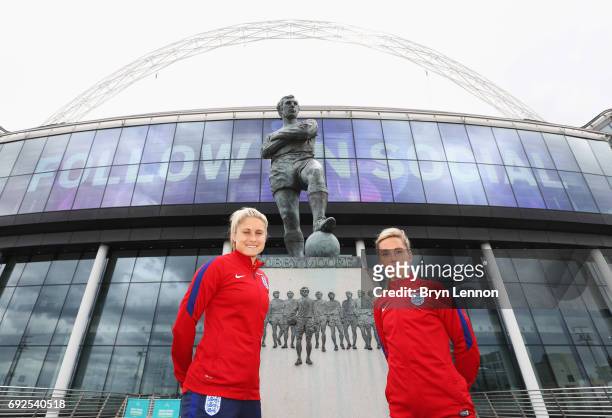 Steph Houghton and Jordan Nobbs of England pose alongside the Sir Bobby Moore statue outside the stadium during an England Women Euro 2017 media day...