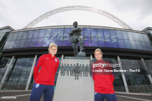 Steph Houghton and Jordan Nobbs of England pose alongside the Sir Bobby Moore statue outside the stadium during an England Women Euro 2017 media day...