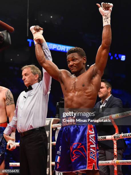 Christian Mbilli celebrates his victory against Cesar Ugarte during the middleweight match at the Bell Centre on June 3, 2017 in Montreal, Quebec,...