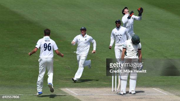 David Wiese of Sussex celebrates with team mates Harry Finch and Chris Jordan after dismissing Ross Whiteley, caught behind by Michael Burgess,...