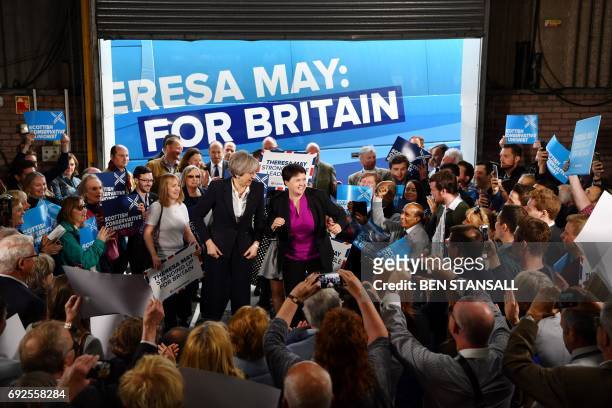 British Prime Minister Theresa May and Scottish Conservative and Unionist Party leader Ruth Davidson speak during a general election campaign visit...