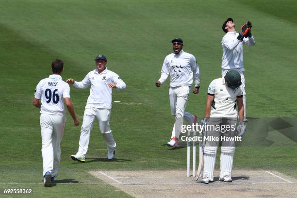 David Wiese of Sussex celebrates with team mates Harry Finch and Chris Jordan after dismissing Ross Whiteley, caught behind by Michael Burgess,...