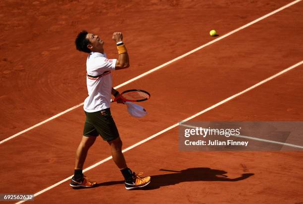 Kei Nishikori of Japan celebrates victory in the mens singles fourth round match against Ferdando Verdasco of Spain on day nine of the 2017 French...