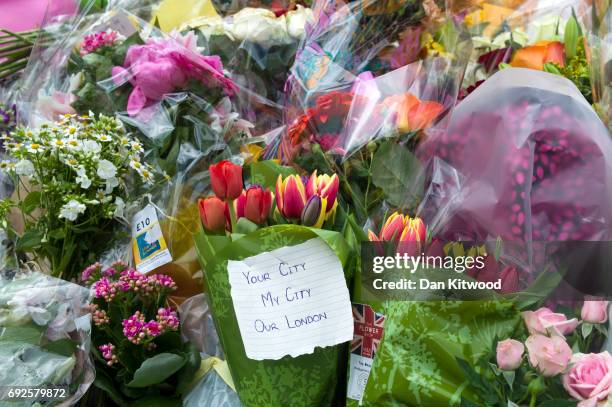 Flowers are laid on the South side of London Bridge, close to Borough Market in London in tribute to the victims of the June 3 attacks, on June 5,...