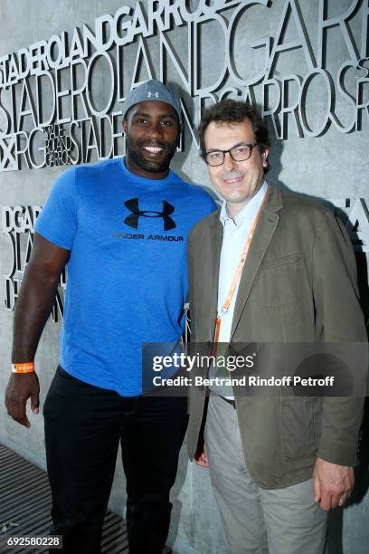 Judoka Teddy Riner and Director of Sports at 'France Television' Laurent-Eric Le Lay pose at France Television french chanel studio during the 2017...