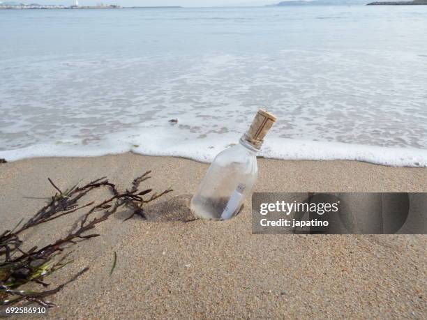 message in a bottle - castaway island fiji stock pictures, royalty-free photos & images