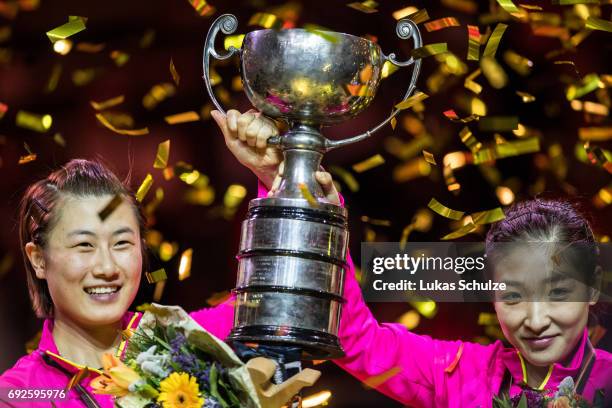 Ding Ning and Liu Shiwen of China celebrate with the trophy after winning the Women's Doubles Final match during the Table Tennis World Championship...