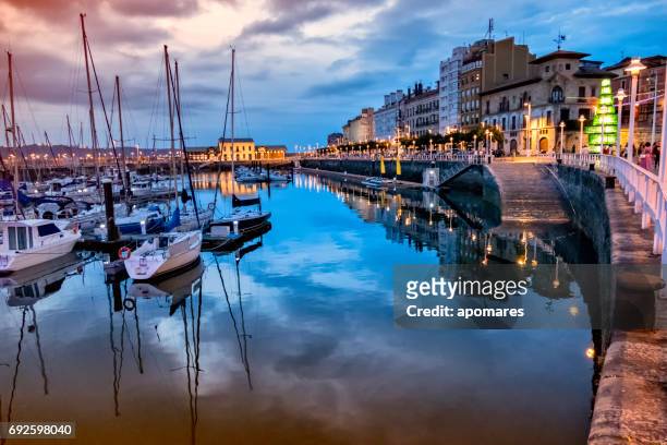 sunset view of gijon old port, asturias, spain - gijon stock pictures, royalty-free photos & images