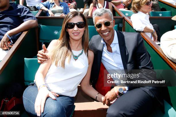 Journalist Rachid M'Barki and his companion Bouchra attend the 2017 French Tennis Open - Day Height at Roland Garros on June 4, 2017 in Paris, France.