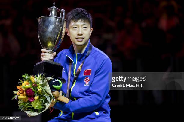 Ma Long of China poses with a trophy during celebration ceremony of Men's Singles Final at Table Tennis World Championship at Messe Duesseldorf on...